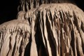 Being guided through Tham Lod Cave with only a gas lamp for light.