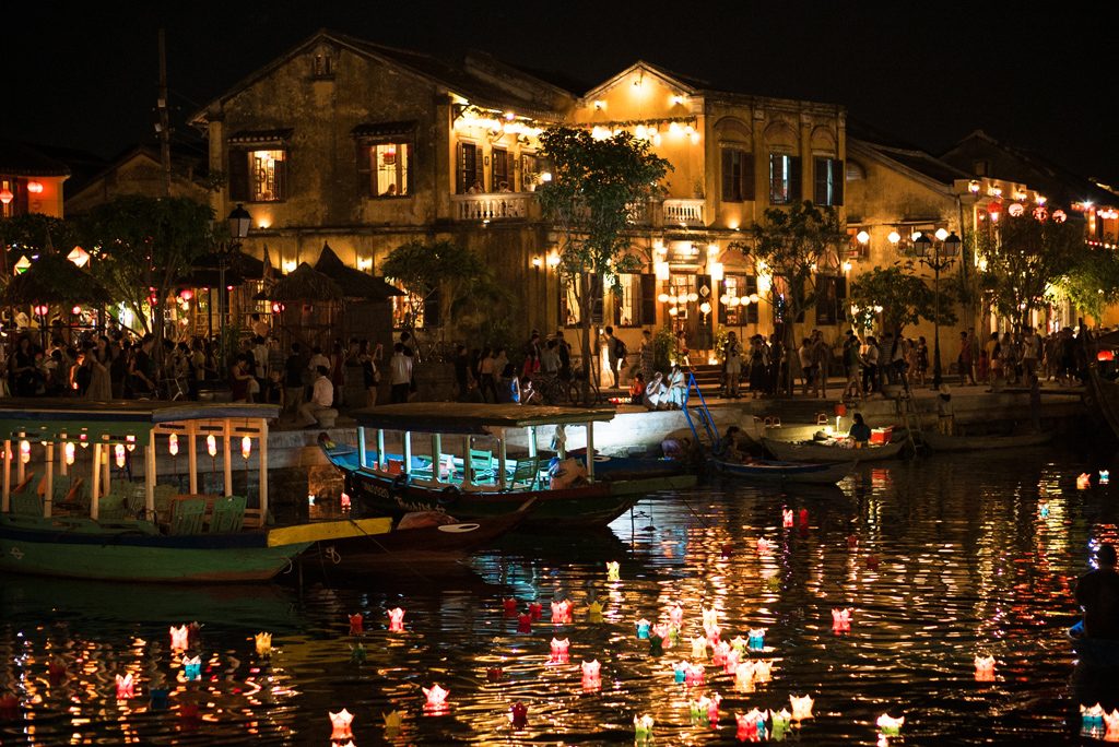 Light a lantern at the traditional lantern festival in Hoi An